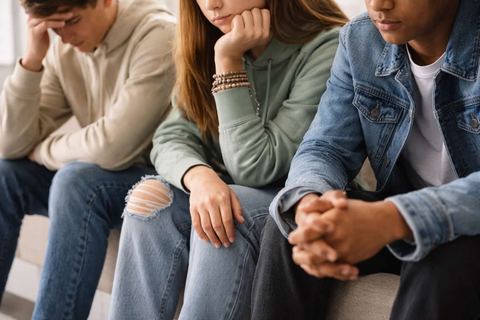 Three teenagers concerned about the link between youth and addiction