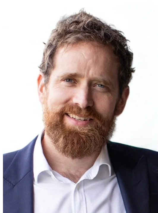 Jamie Giles' professional headshot against a white background